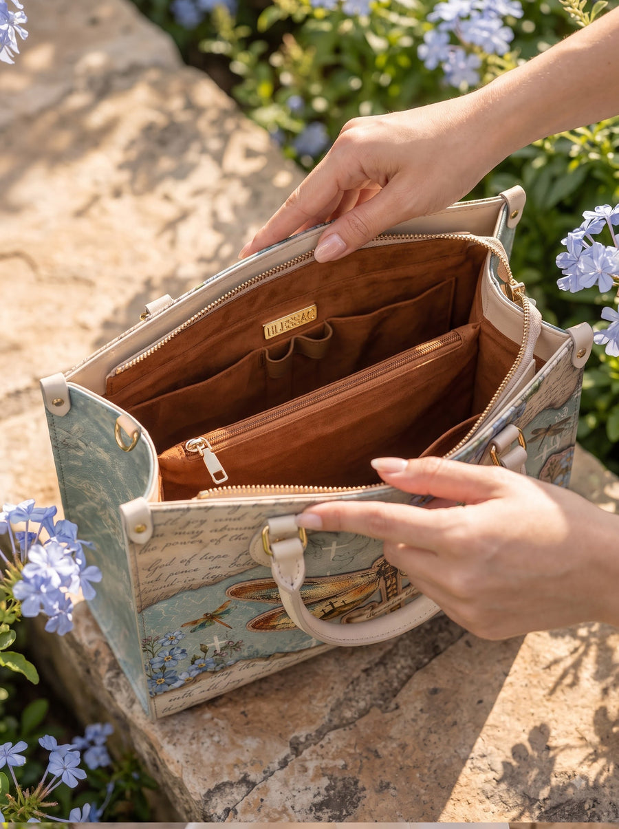 Open handbag showing 4 organized interior compartments