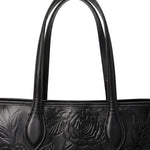 Double shoulder straps of the sable black embossed leather tote