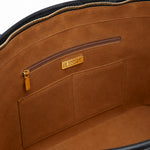 Interior view — soft cognac lining, zip pocket and gold Blessac plaque