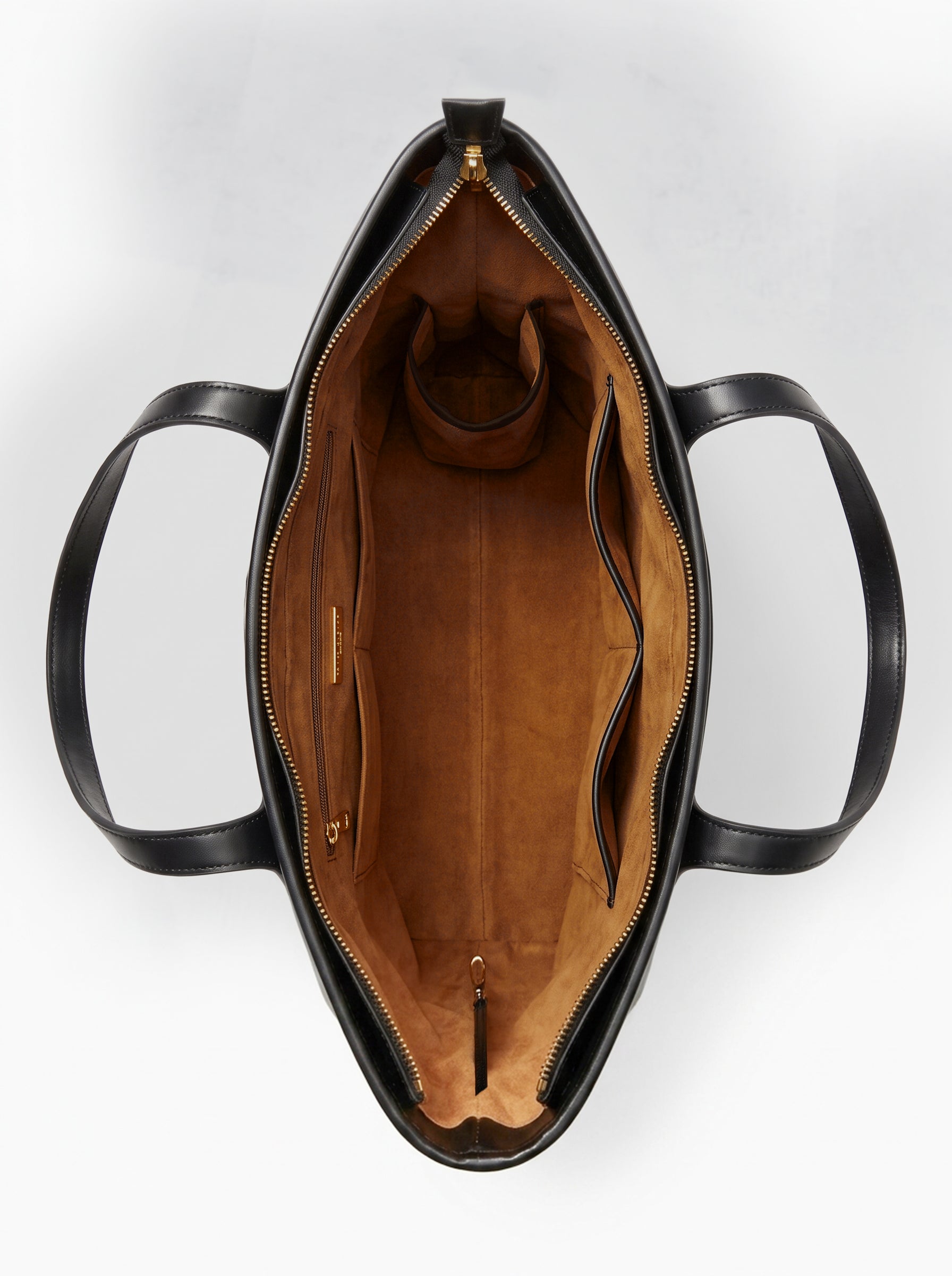 Top-down open view of the roomy interior with zip and slip pockets