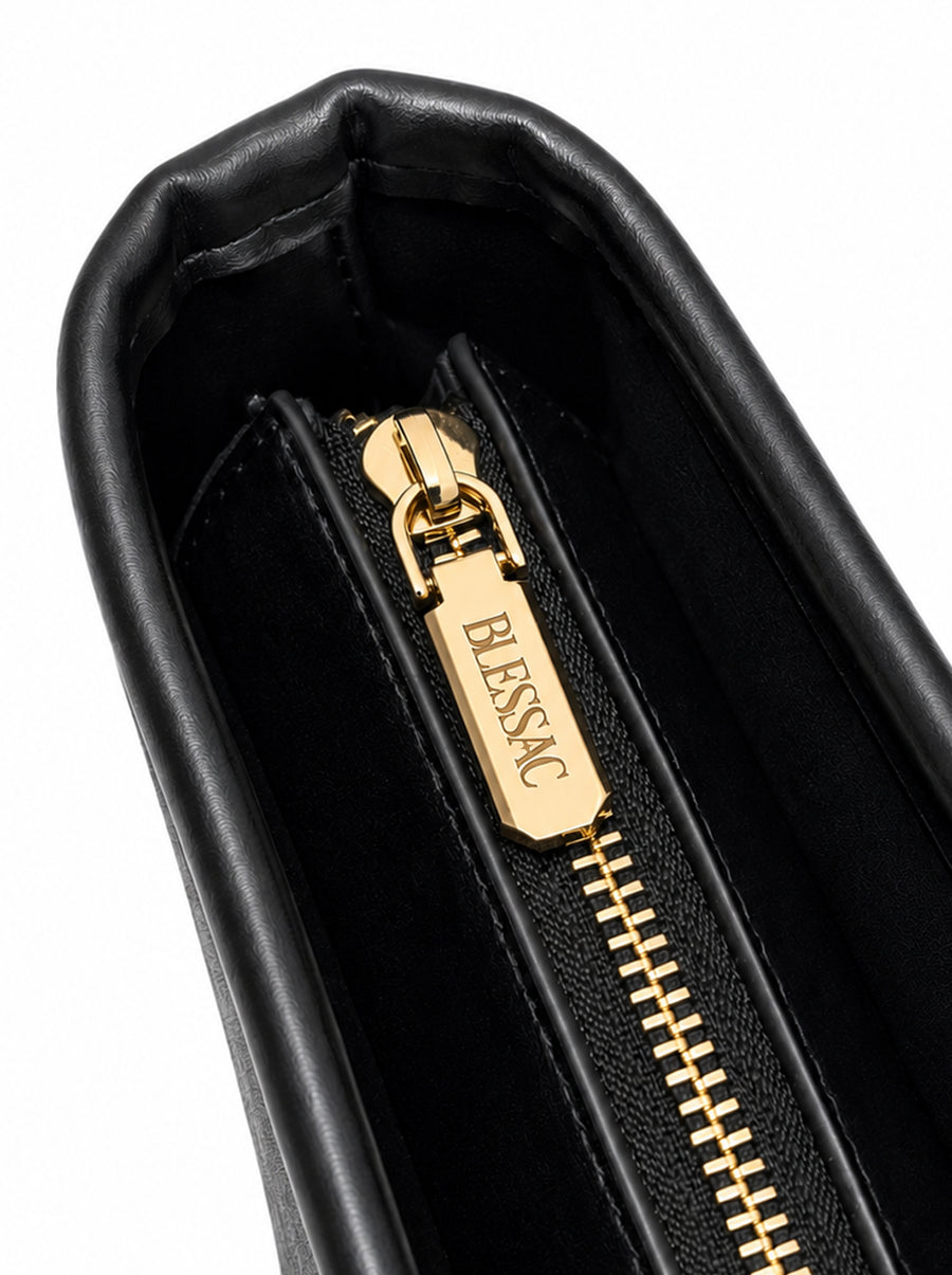 Gold-tone Blessac engraved zipper pull close-up