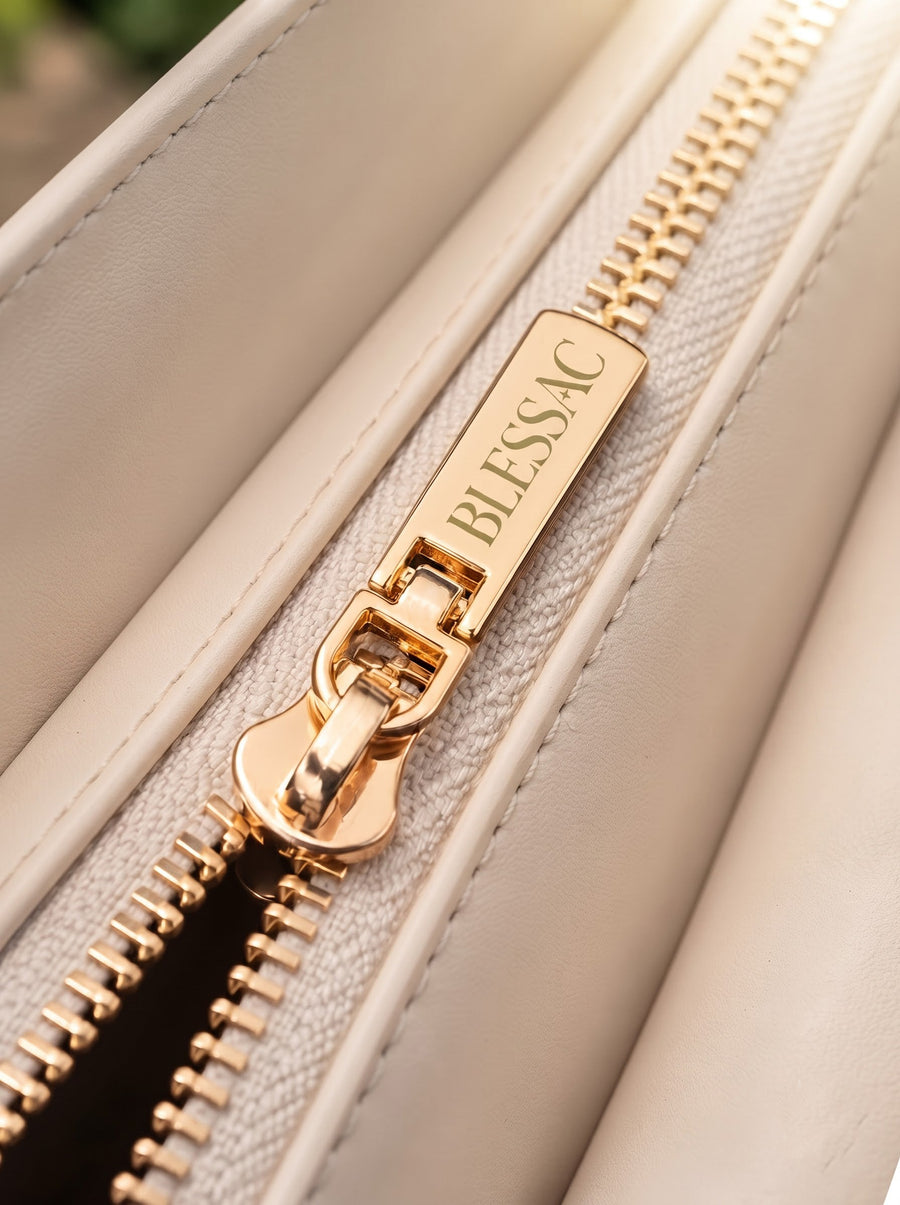 Gold Blessac-stamped zipper close-up