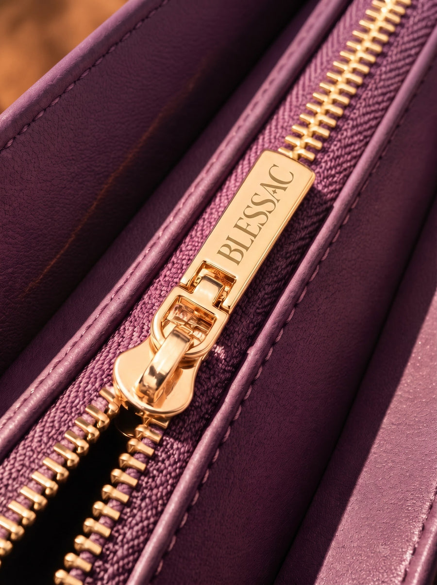 Gold Blessac-stamped zipper close-up