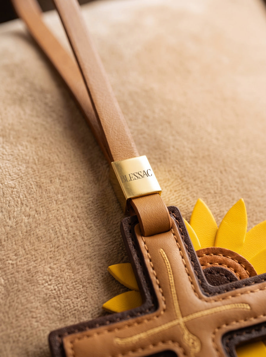 "Rooted in Faith" - Sunflower Cross Leather Bag Charm