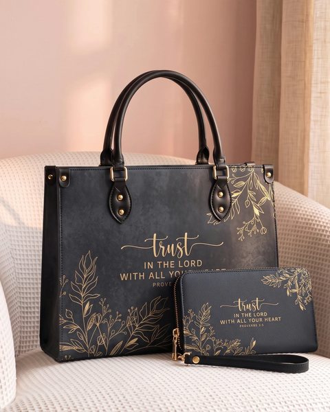 The Trust handbag and wallet side by side on a chair