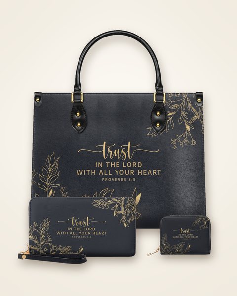 The Trust handbag with its matching wallet and mini wallet, each with Proverbs 3:5 in gold