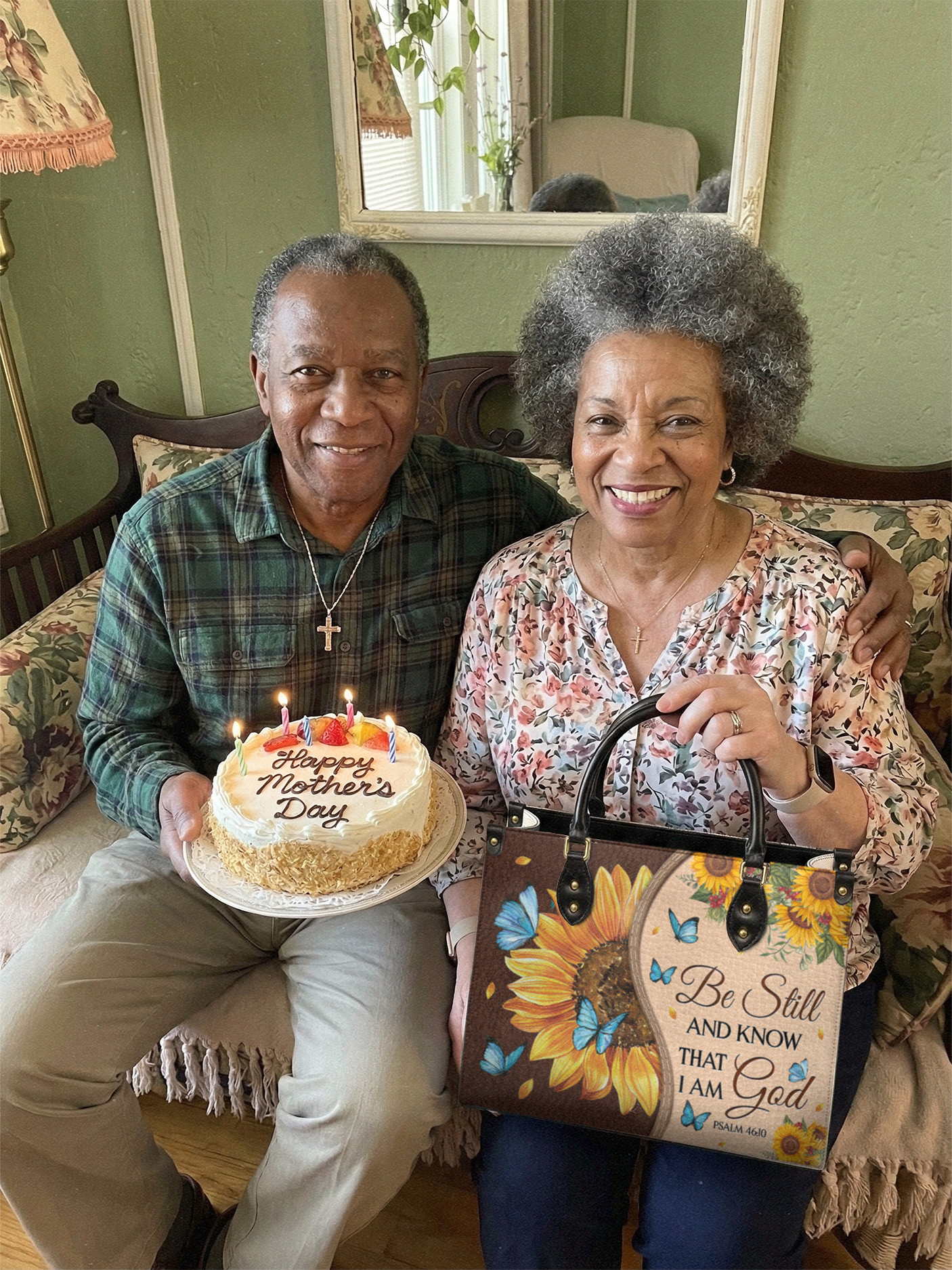 Husband and wife with Blessac bag and Mother's Day cake